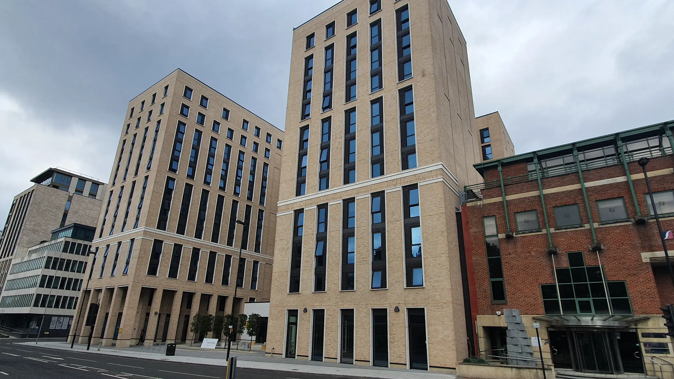 Completed Cumberland Place towers and retained neighbouring brick building