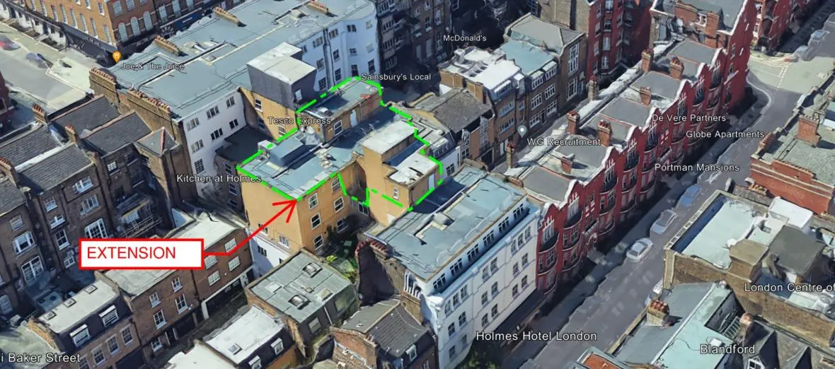 Aerial view highlighting the proposed roof-level extension at Holmes Hotel