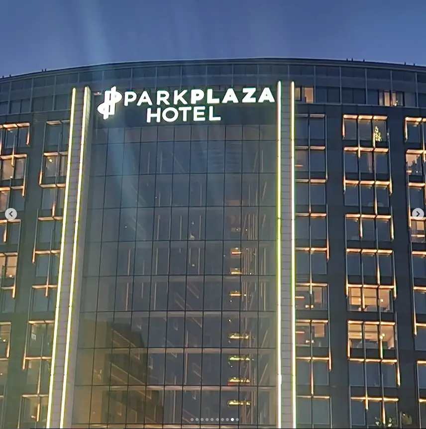 Completed illuminated Park Plaza Hotel façade signage at dusk