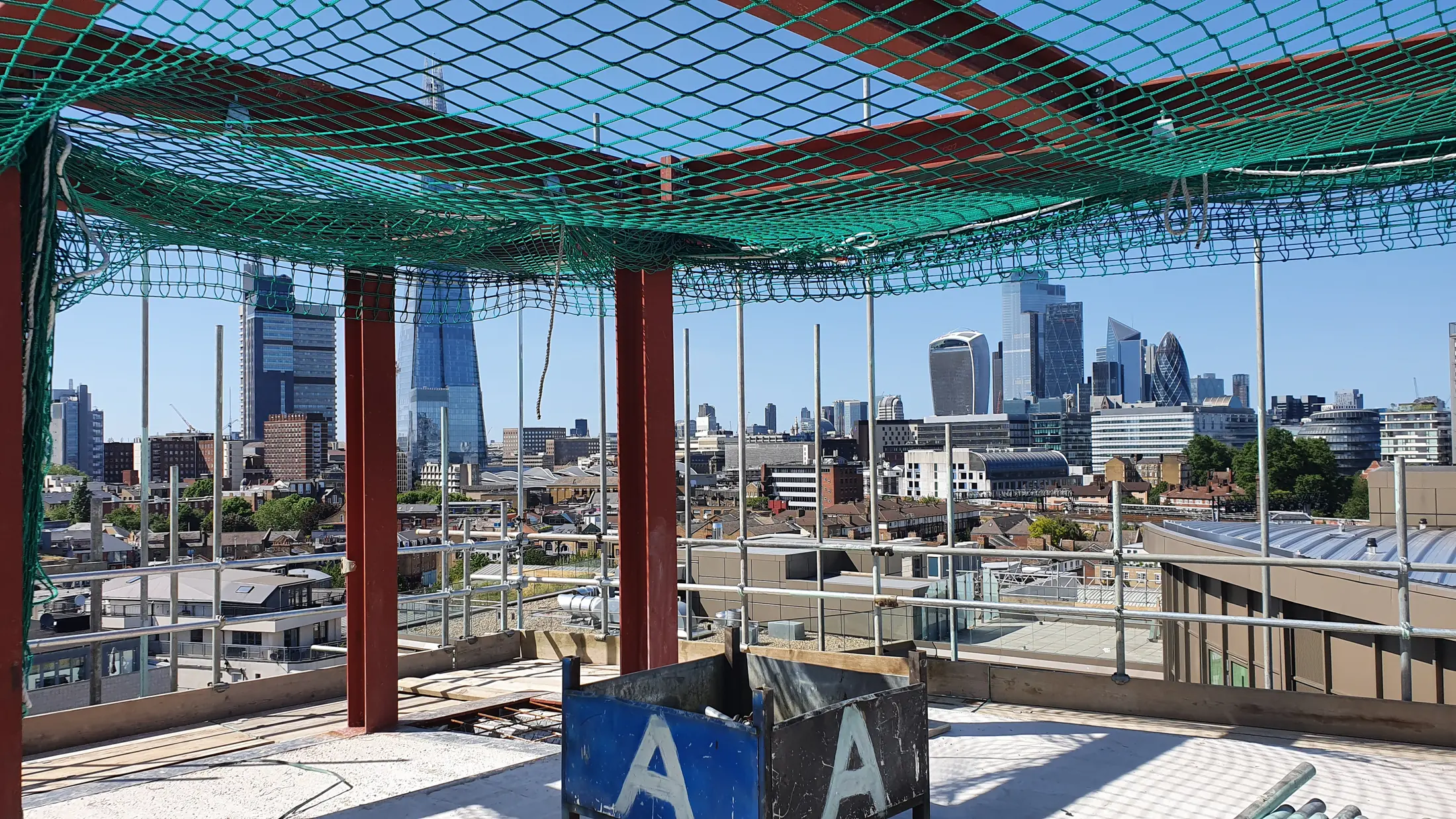 Tower Bridge Road rooftop steel frame with the London skyline beyond