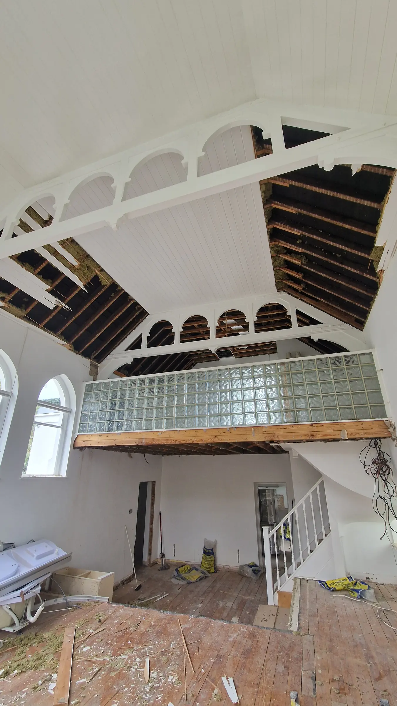 Curved staircase structure during construction at Trinity Close